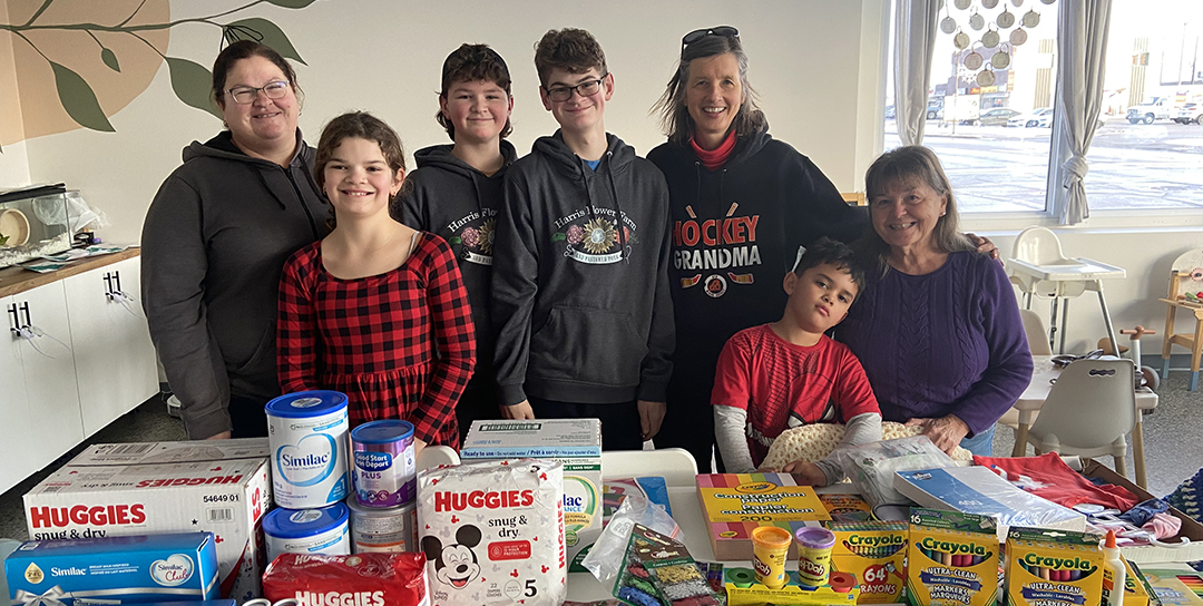 group of kids with donations